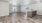 a large empty room with a kitchen island