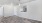 a room with a wood floor and a wood floor with a window