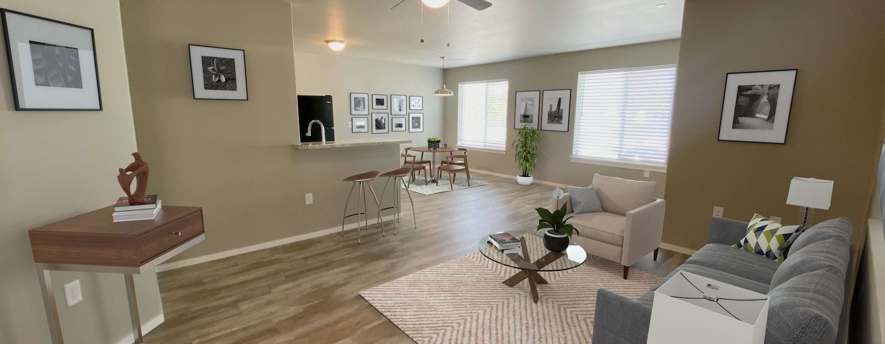 a living room with a couch a rug a table and windows