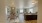 a dining area and kitchen with a bar