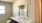 bathroom with a sink and mirror and toilet