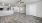 a large empty living room and a kitchen