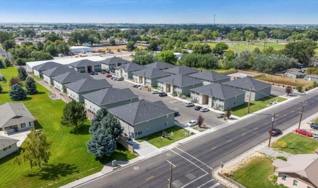 a neighborhood street with houses and trees