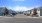a neighborhood street with cars parked