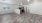 a large empty living room with a kitchen