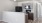 a kitchen with a black refrigerator