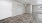 a living room with a wood floor and white doors