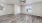 a living room with a wood floor and a ceiling fan